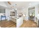 Bright kitchen featuring an island with white marble countertops, and stainless steel appliances at 153 High Hills Dr, Mooresville, NC 28117