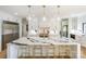Gourmet kitchen featuring waterfall island, pendant lighting, and stainless steel appliances at 153 High Hills Dr, Mooresville, NC 28117