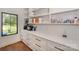 Well-organized pantry with white cabinetry, quartz countertops, and open shelving for ample storage at 153 High Hills Dr, Mooresville, NC 28117