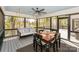 Inviting screened porch with a swing and seating area, perfect for relaxation at 153 High Hills Dr, Mooresville, NC 28117