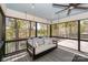 Relaxing screened porch with a comfortable swing and views of the lake at 153 High Hills Dr, Mooresville, NC 28117