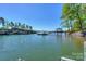 Scenic view of a waterfront property with multiple boat docks and clear lake waters at 153 High Hills Dr, Mooresville, NC 28117