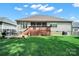 Spacious backyard featuring a deck and lush lawn, perfect for relaxation and entertaining at 1589 Essex Hall Dr, Rock Hill, SC 29730