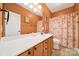 This bathroom features a large mirror over the sink and a shower with a patterned curtain at 1589 Essex Hall Dr, Rock Hill, SC 29730