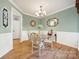 Elegant dining room with wainscoting and a stylish chandelier at 1589 Essex Hall Dr, Rock Hill, SC 29730