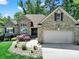 Beautiful brick house with meticulously maintained front yard landscaping at 1589 Essex Hall Dr, Rock Hill, SC 29730