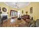 Cozy living room featuring a fireplace, hardwood floors, and comfortable seating at 1589 Essex Hall Dr, Rock Hill, SC 29730