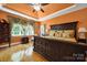 Spacious main bedroom with hardwood floors, high ceilings, bedside tables, and natural lighting from large windows at 1589 Essex Hall Dr, Rock Hill, SC 29730