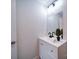 Half bathroom with modern lighting and a sink with a black faucet at 163 Briarcliff Dr, Kannapolis, NC 28081