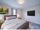 Comfortable bedroom features calming decor, wood-look floors, and a mounted television at 163 Briarcliff Dr, Kannapolis, NC 28081