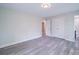 This is a bright bedroom with wood-look floors and a double door closet at 163 Briarcliff Dr, Kannapolis, NC 28081
