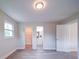 Spacious bedroom with wood-look floors, a window, and connections to a bathroom and closet at 163 Briarcliff Dr, Kannapolis, NC 28081