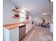 Bright kitchen with a view into the dining area, showcasing butcher block countertops and stainless appliances at 163 Briarcliff Dr, Kannapolis, NC 28081
