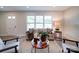 Bright living room features a large window, neutral walls, and stylish furniture arrangement at 163 Briarcliff Dr, Kannapolis, NC 28081