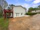 Backyard with a raised deck and a spacious paved parking area at 173 8Th Ave, Conover, NC 28613