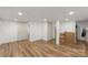 A finished basement room that features wood flooring and plenty of storage at 173 8Th Ave, Conover, NC 28613