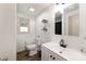 Bright bathroom features a modern vanity, black faucet, and a large mirror at 173 8Th Ave, Conover, NC 28613