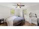 Comfortable bedroom featuring a ceiling fan, two windows, and a neutral color scheme at 173 8Th Ave, Conover, NC 28613