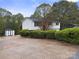 Charming home exterior with well-manicured landscaping and a paved driveway at 173 8Th Ave, Conover, NC 28613