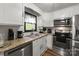 Updated kitchen with granite countertops, stainless steel appliances and modern white cabinets at 173 8Th Ave, Conover, NC 28613