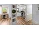 Inviting view of a bright, white kitchen with stainless steel appliances and wood-look floors at 173 8Th Ave, Conover, NC 28613