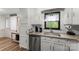 Close-up of the kitchen with stainless steel appliances, granite counters and white cabinets at 173 8Th Ave, Conover, NC 28613