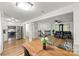 Open-concept living space, connecting the kitchen, dining and living room with luxury vinyl flooring at 173 8Th Ave, Conover, NC 28613
