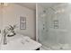 A modern bathroom features a glass-enclosed shower, a floating vanity, and a minimalist design aesthetic at 1900 Lakedell Dr, Charlotte, NC 28215