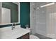 Stylish bathroom with a decorative mirror, glass shower, and modern fixtures at 1900 Lakedell Dr, Charlotte, NC 28215