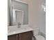 Modern bathroom featuring a large mirror, contemporary fixtures and white tile accents at 1900 Lakedell Dr, Charlotte, NC 28215