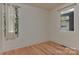 Well-lit bedroom with a window and minimalist design elements at 1900 Lakedell Dr, Charlotte, NC 28215