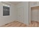 Open bedroom with closet space, bright light, and hardwood floors at 1900 Lakedell Dr, Charlotte, NC 28215