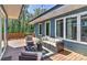 Relaxing deck with seating, a view of the trees and outdoor lighting at 1900 Lakedell Dr, Charlotte, NC 28215