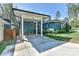 Exterior of the home shows a covered carport and well-maintained lawn and landscaping, enhancing curb appeal at 1900 Lakedell Dr, Charlotte, NC 28215