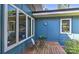 A cozy outdoor deck showcasing a table, chairs, and large windows at 1900 Lakedell Dr, Charlotte, NC 28215