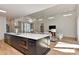 A light-filled open-concept living room features a large island, hardwood floors, and high ceilings with clerestory windows at 1900 Lakedell Dr, Charlotte, NC 28215