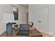 A functional office area with a wooden desk, globe, and a laptop for productive work at 1900 Lakedell Dr, Charlotte, NC 28215