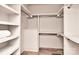 A well-organized walk-in closet is shown featuring custom shelving, rods, and ample storage space for clothing at 1900 Lakedell Dr, Charlotte, NC 28215