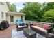 View of back deck with tan couches, blue chairs and a black grill at 201 Olde Coach Ln, Crouse, NC 28033