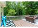 Deck offers multiple places to sit and enjoy view of treed backyard at 201 Olde Coach Ln, Crouse, NC 28033