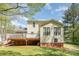 Back exterior view showcasing a deck, yard, and natural lighting on a sunny day at 201 Olde Coach Ln, Crouse, NC 28033