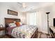 Cozy bedroom with hardwood floors, soft lighting, and a comfortable bed with colorful accents at 201 Olde Coach Ln, Crouse, NC 28033