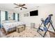 Cozy bedroom with a comfortable bed, ceiling fan, and ample natural light at 201 Olde Coach Ln, Crouse, NC 28033