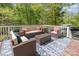 Outdoor deck with comfortable seating area, perfect for entertaining or relaxing in a wooded setting at 201 Olde Coach Ln, Crouse, NC 28033