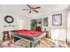 Bright game room with a pool table, complemented by a ceiling fan and neutral wall paint at 201 Olde Coach Ln, Crouse, NC 28033