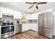 Modern kitchen with stainless steel appliances, granite countertops, and white cabinetry at 201 Olde Coach Ln, Crouse, NC 28033