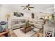 Inviting living room with comfortable seating, a ceiling fan, and natural light at 201 Olde Coach Ln, Crouse, NC 28033