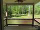 Enjoy a serene view of the landscaped backyard from this charming covered porch at 2127 Cedar Rd, York, SC 29745