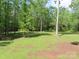 Spacious backyard featuring mature trees, lush green grass and plenty of sunlight at 2127 Cedar Rd, York, SC 29745