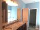 Bathroom featuring granite vanity, modern sink and fixtures with soaking tub in the background at 2127 Cedar Rd, York, SC 29745